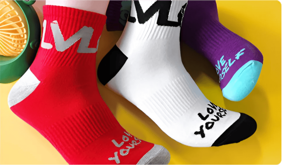 Bright, cozy socks featuring motivational text and vibrant colors, perfect for knitting lovers and craft enthusiasts.