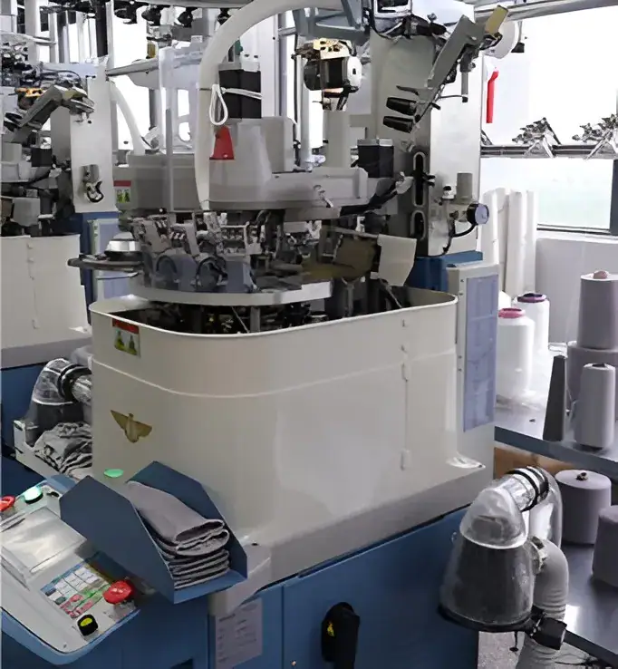 High-tech sock knitting machine with automated yarn feeding and pattern control.