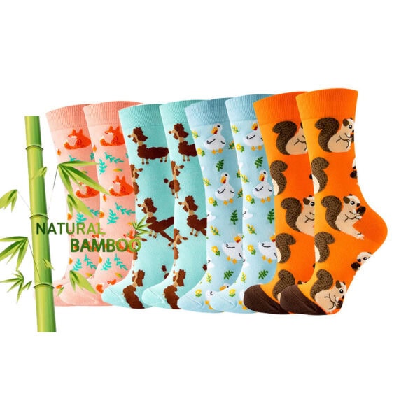Set of six colorful socks with animal patterns including pandas, dogs, and ducks, designed for Pilates and yoga practice, featuring bamboo-themed packaging.