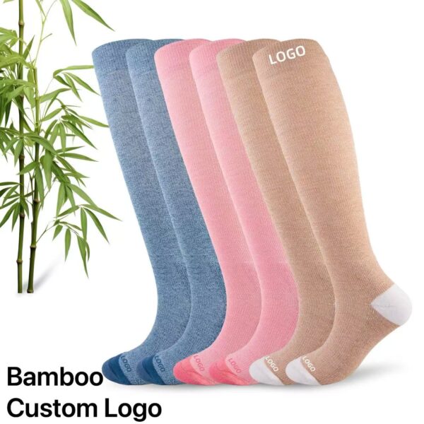 Set of four bamboo socks in blue, pink, beige, and white with customizable logo area, ideal for sports, business, or promotional use.