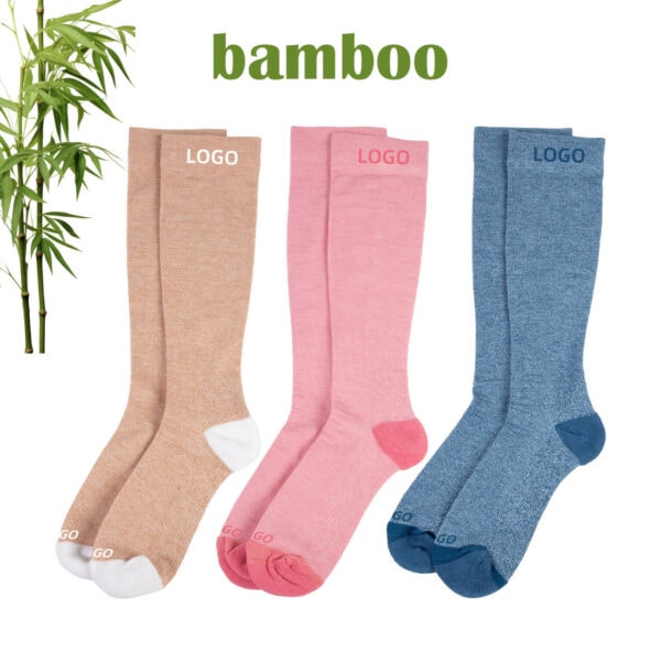 Three pairs of custom bamboo sports socks in beige, pink, and blue with logo space, ideal for athletic or casual wear.